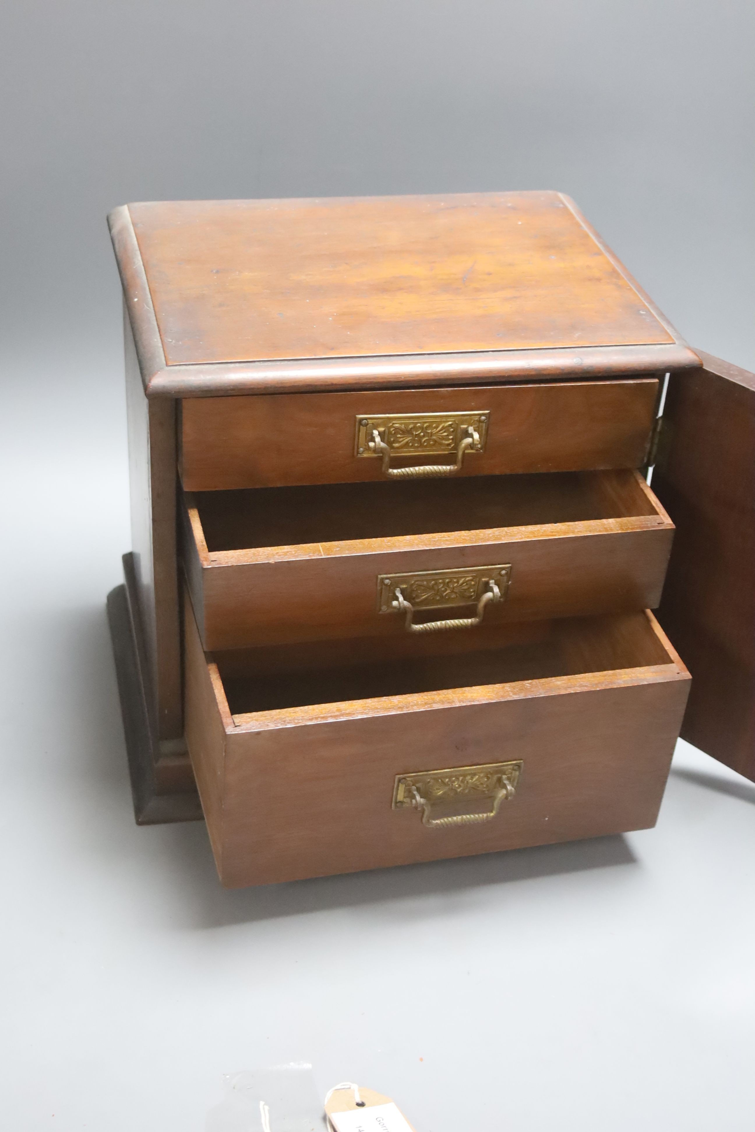 A Victorian mahogany desk top cabinet of three drawers, 29cm wide